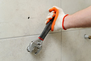 Worker unscrew the nut.