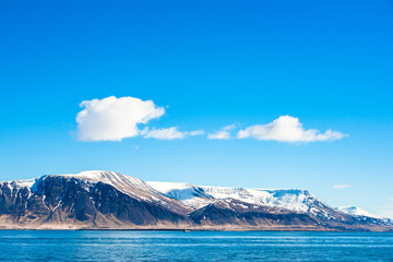 Skies over a mountain in the ocean