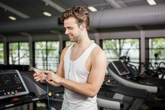 Man listening to music on treadmill