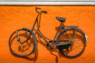Fototapeta na wymiar Vintage bike hanging on a wall