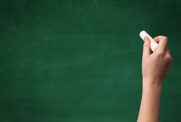 Hand writing on clean blackboard © ra2 studio