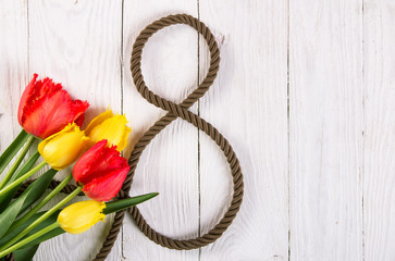 Obraz premium bouquet of tulips and a figure eight of rope
