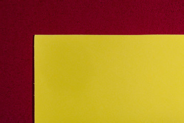 Eva foam ethylene vinyl acetate smooth lemon yellow surface on red sponge plush background