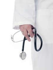 mid section of a doctor holding stethoscope.