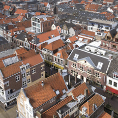 Vintage tiled roofs in the old downtown of Delft, Netherlands in the beginning of spring.