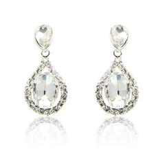 Pair of diamond earrings isolated on white