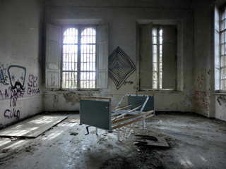 Vintage old hospital bed in abandoned hospital room