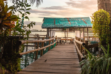 Obraz premium Wide shot of romantic restaurant with sea view at sunset. Panglao Island, Philippines.