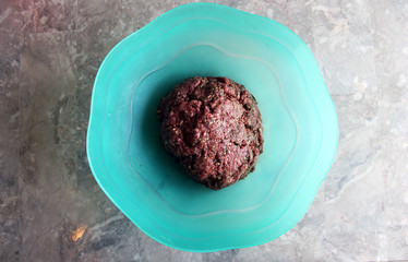 Raw Meatball Mixture in a Blue Bowl