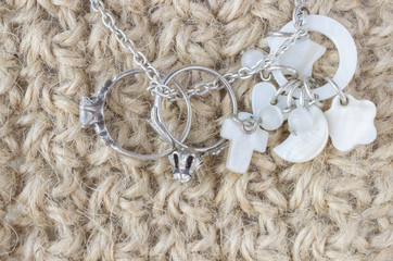 Knitting crochet lace background with silver necklace