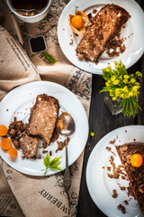 Two slices of pie and tea on wooden background