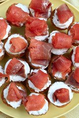 Tartlets with cheese and slices of fish