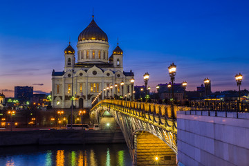 Moscow - Majestic orthodox Cathedral of Christ Saviour illuminated at dusk on bank of Moscow river. It is tallest Orthodox church in world.