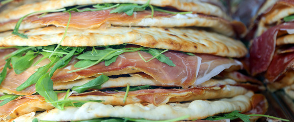 flatbread with ham and Arugula in the italian restaurant