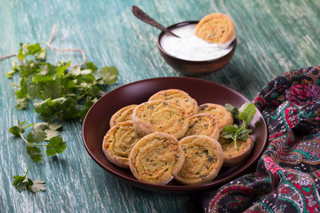 Indian potato rolls with yogurt sauce