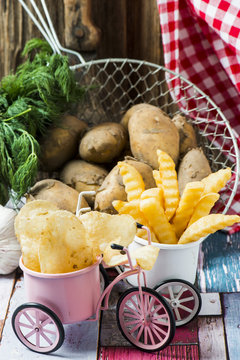 Chips fries and new potatoes on background.Selective Focus.
