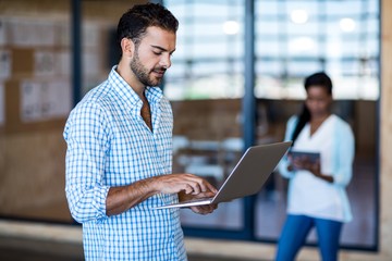 Young man using laptop