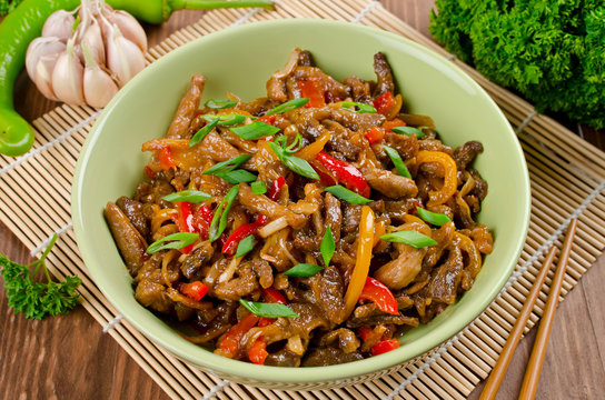 Stir fry pork, sweet peppers, onions and garlic