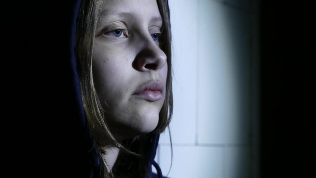 Teen girl. Drug addiction. Depressed face of a teen girl with overdose or hangover-abstinence syndrom from drugs. 4K UHD.
