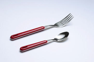 red metal fork and spoon