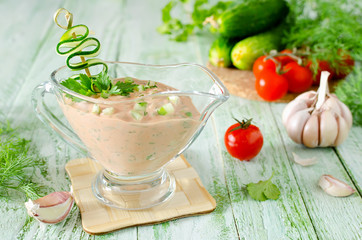 Fresh tomato sauce for meat on a wooden table