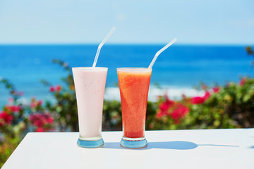 Two delicious fresh juices or smoothies on a tropical resort