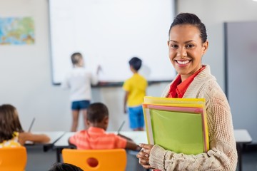 A teacher smiling at camera 