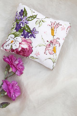 Cushion with flower decoration
