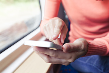 Obraz premium Woman Using a Smart Phone.