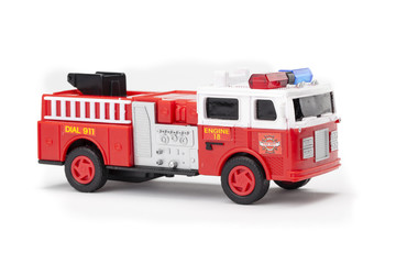 Fototapeta na wymiar miniature fire truck on white background