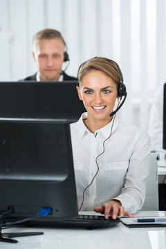 Female Employee Working In Call Center