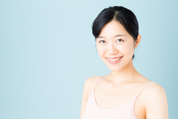 attractive asian woman skincare image on blue background