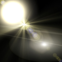 Abstract lens flare light over dark background