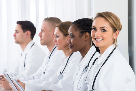 Female Doctor Working With Her Colleagues