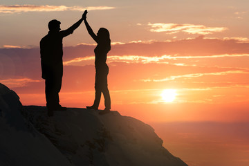 Silhouette Of A Couple On Hill