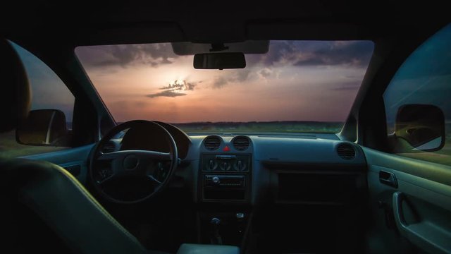 3 in 1! The flow of cloud against the sunset. Inside car view. Time lapse