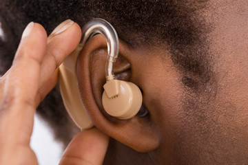Woman Wearing Hearing Aid In Ear