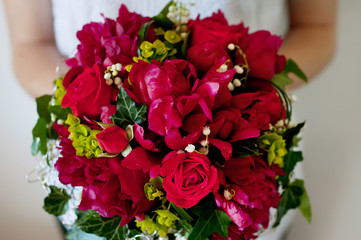 Fresh bridal bouquet. Red summer flowers.