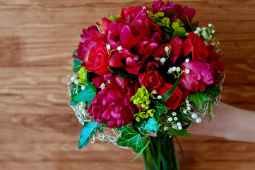 Fresh bridal bouquet. Red summer flowers.