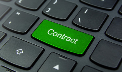 Business Concept: Close-up the Contract button on the keyboard and have Lime, Green color button isolate black keyboard