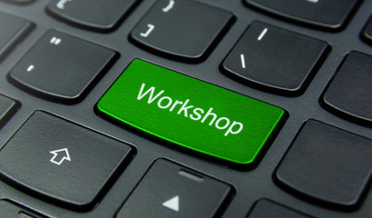 Business Concept: Close-up the Workshop button on the keyboard and have Lime, Green color button isolate black keyboard