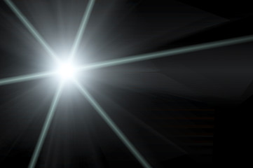 Abstract lens flare light over dark background