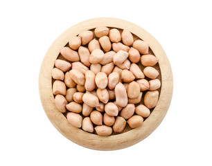 Dry peanut seeds in wooden dish.