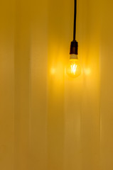 Lamp lights and a yellow wall