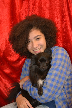 Chihuahua And Curly Girl/Frizzy Haired Girl Holding A Small Dog