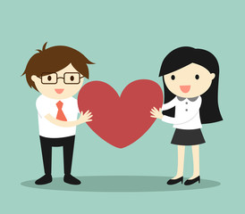 Business concept, Love in office. Businessman and business woman are holding red heart and feeling happy. 