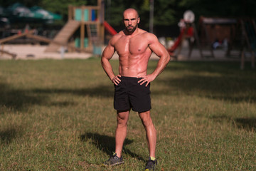 Portrait Of A Bodybuilder Posing Outdoors