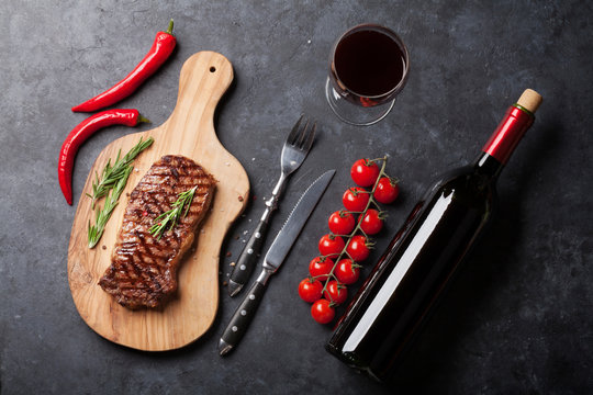 Grilled striploin steak and wine