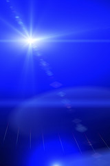 Abstract lens flare light over dark background