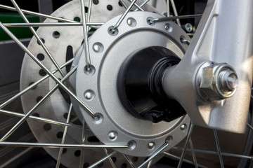 closeup on caliper brake of motorcycle